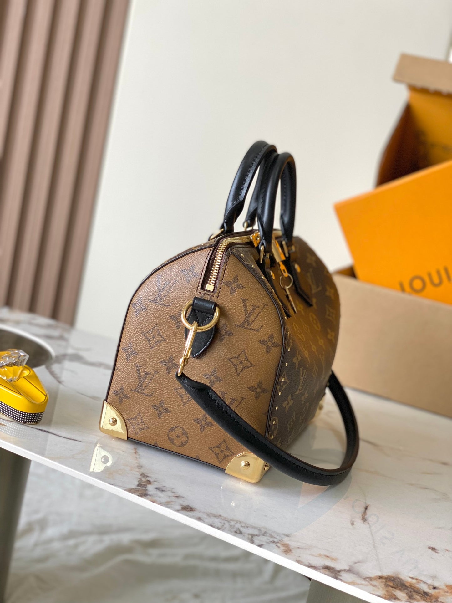 SPEEDY TRUNK 25 HANDBAG  M26181